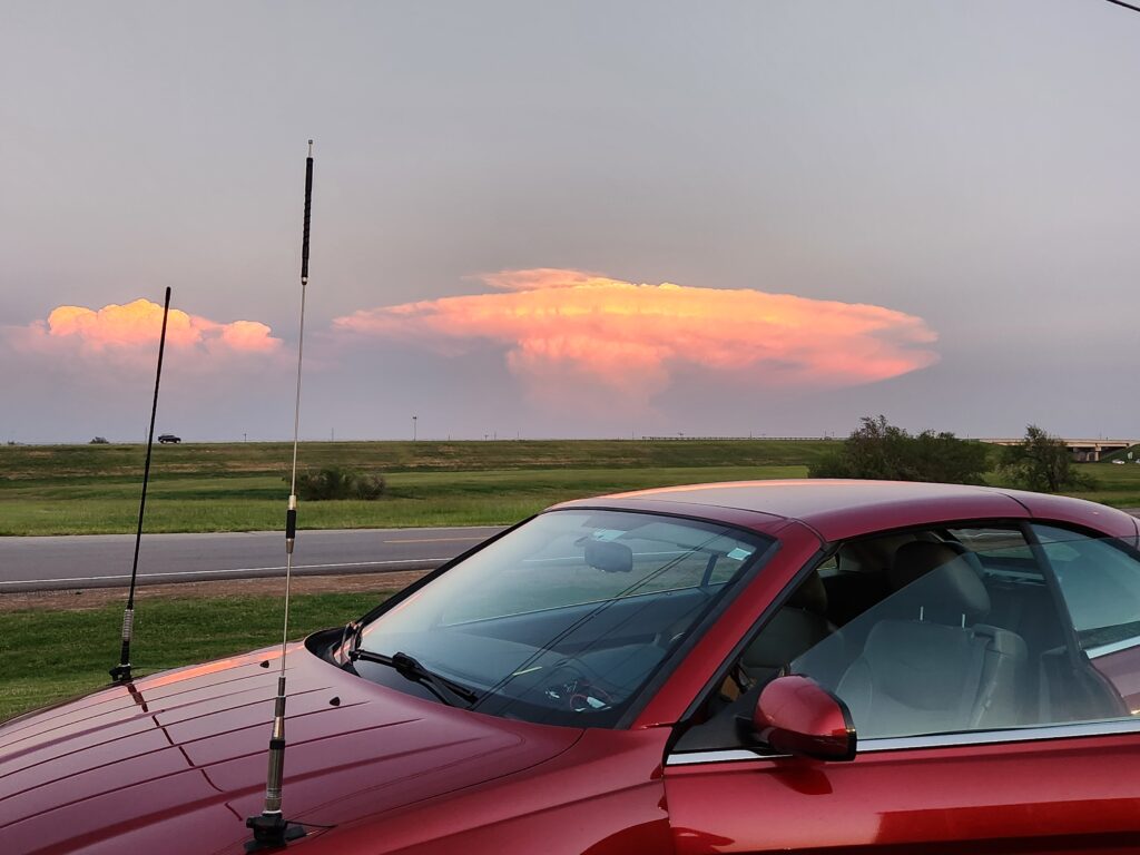 Jackson Gunter's car parked in front of a neat cloud formation.