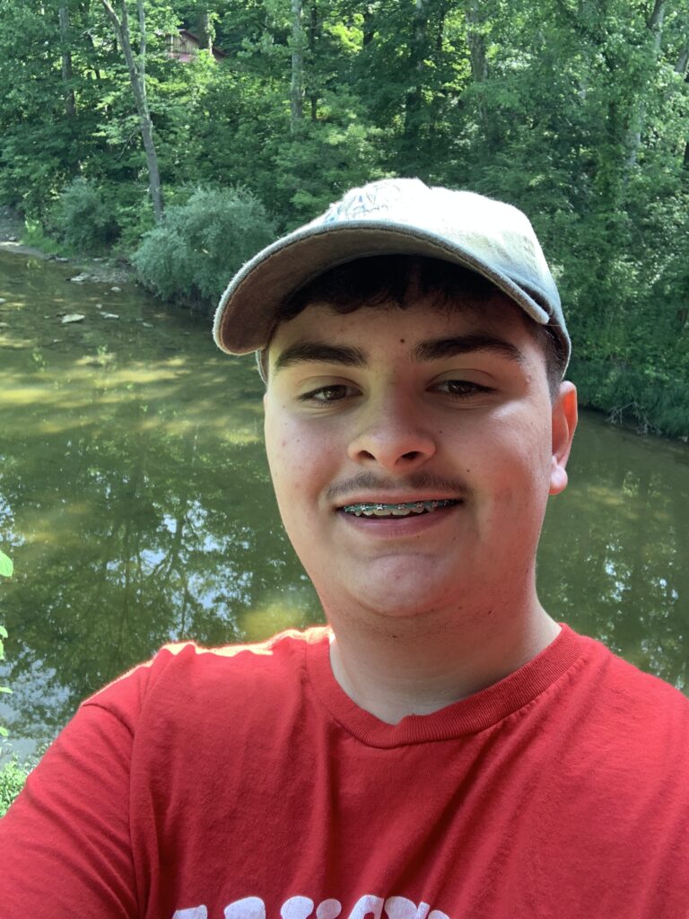 Me KJ5APW standing by a river underneath a covered bridge