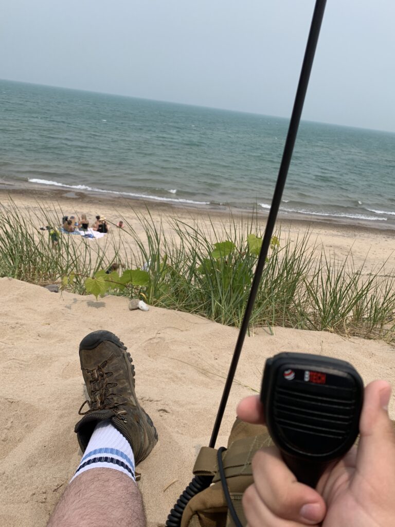 Me KJ5APW operating 2 meter simplex on the beach of lake Michigan.